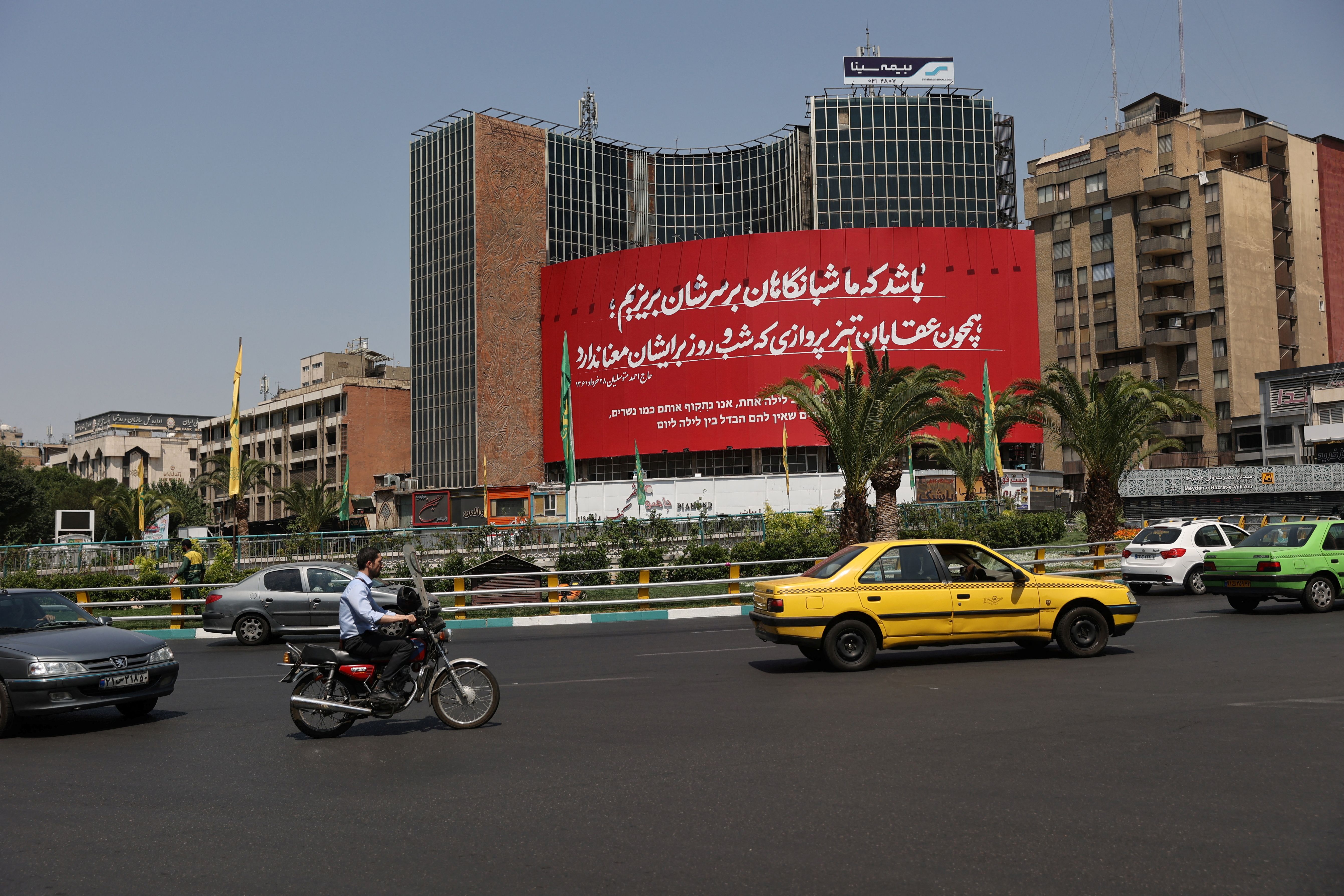 An anti-Israeli billboard is displayed following the Israeli strikes on Iran, in Tehran, Iran, June 14, 2025. 