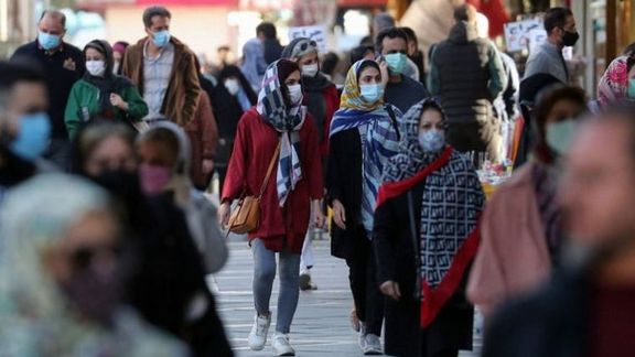 People walking in a Tehran street. Undated