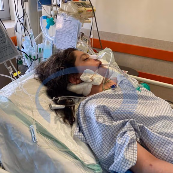 Bleeding from the right ear can be seen in this hospital photo of Mahsa Amini