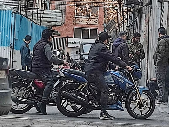 File photo shows the Islamic Republic's security forces stationed in an alley in Tehran following an airstrike
