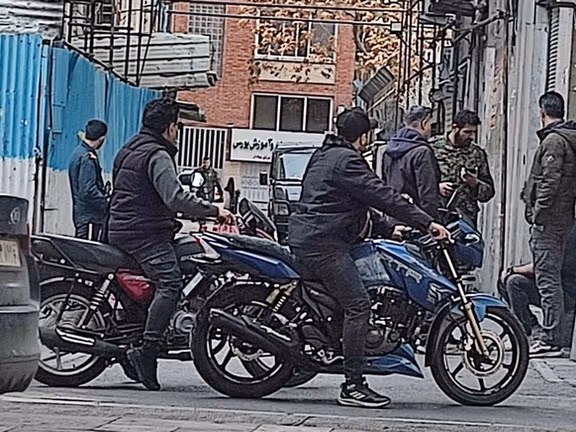 File photo shows the Islamic Republic's security forces stationed in an alley in Tehran following an airstrike