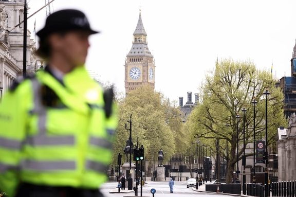 File photo of a forensic official and police officers work at a cordon on Whitehall in Westminster (2022)