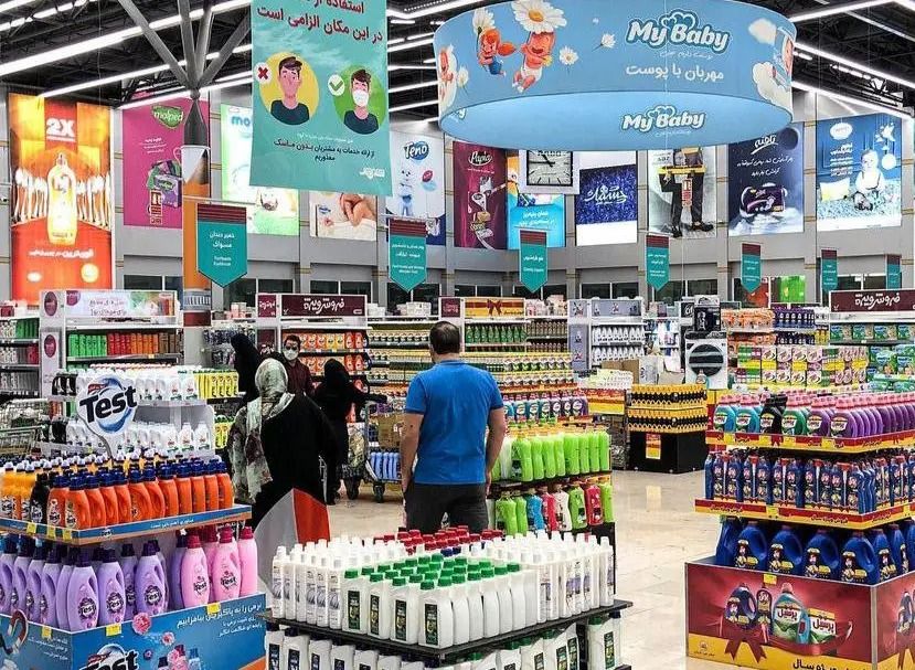 Shoppers browse household and personal-care products at a store in Iran.