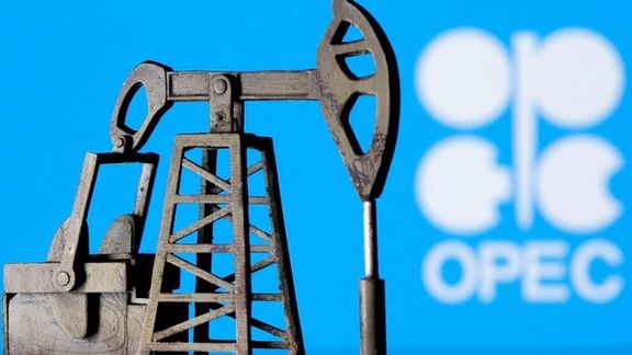 A 3D-printed oil pump jack is seen in front of the OPEC logo in this illustration picture