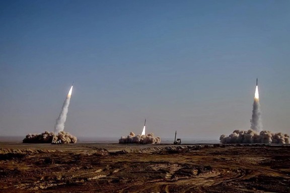 Undated file photo shows Iran test-firing ballistic missiles