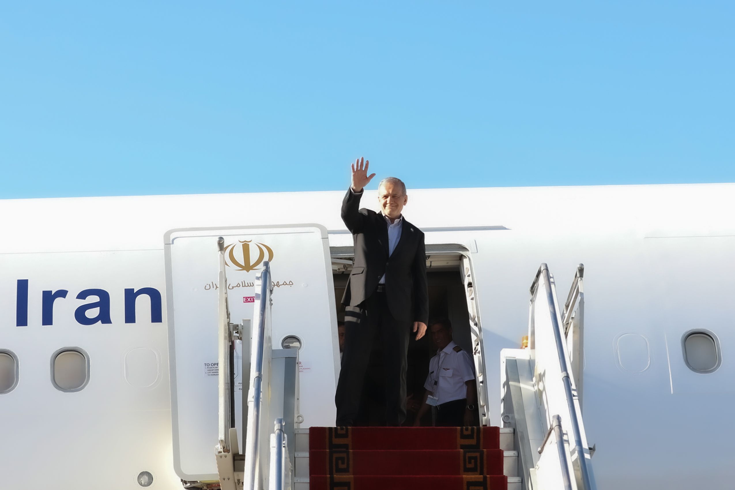 President Masoud Pezeshkian waves as he boards his plane in Tehran before departing for New York on September 22, 2026.