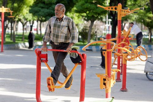 An Iranian man exercising at a park