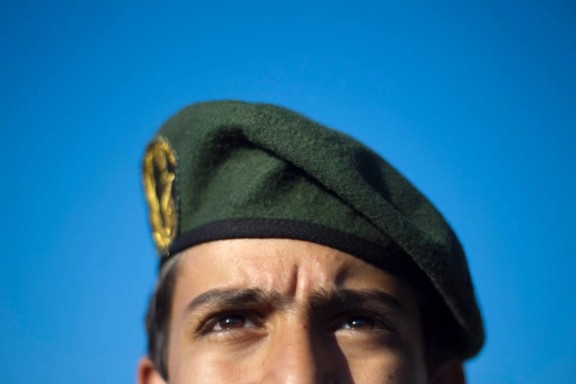 A member of Iran's Revolutionary Guard stands at attention during an anti-US ceremony in Azadi Square in Tehran, April 2010.