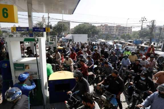 People on motorcycles wait for their turn to get petrol at a petrol station, after Pakistan Petroleum Dealers Association (PPDA) announced a countrywide strike, in Karachi, Pakistan, November 25, 2021.