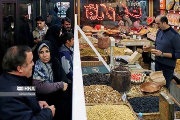 Iranians shopping in a bazaar in Tehran
