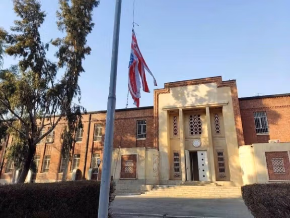The US embassy in Tehran with a shredded US flag. Undated