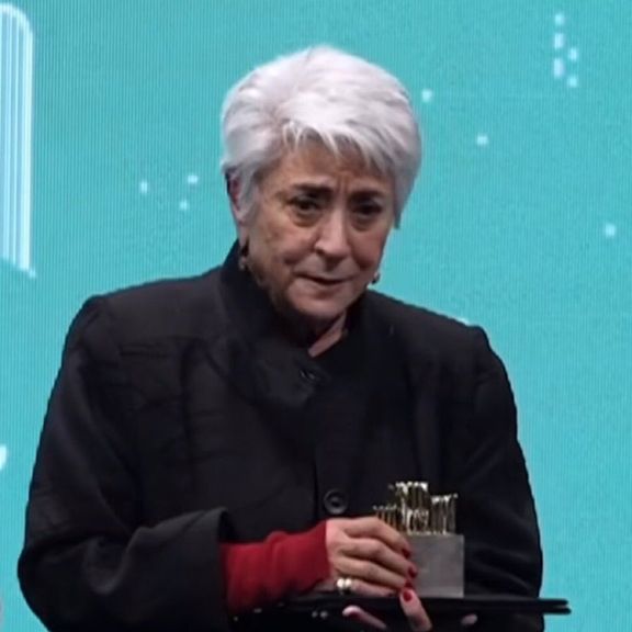 Prominent writer Goli Emami holding her award. December 26, 2024