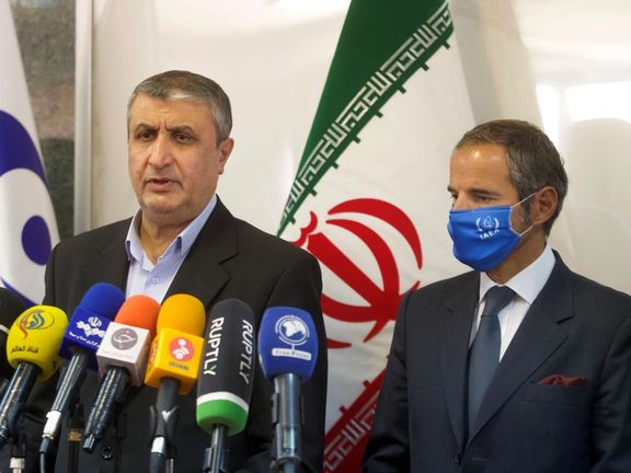 Mohammad Eslami (L) with IAEA's Rafael Grossi in Tehran in 2021