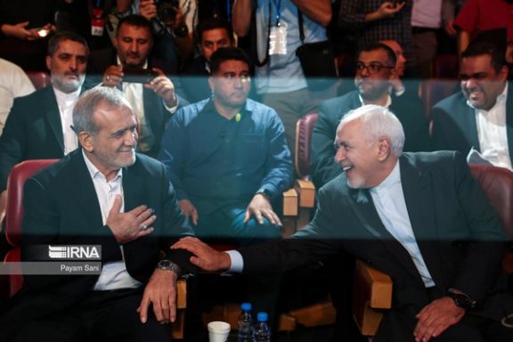 Iran's President-elect Masoud Pezeshkian (left) and former foreign minister Mohammad Javad Zarif during an event in Tehran