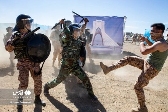 Revolutionary Guards agents during a drill to exercise suppressing dissent in Tehran (October 2023)