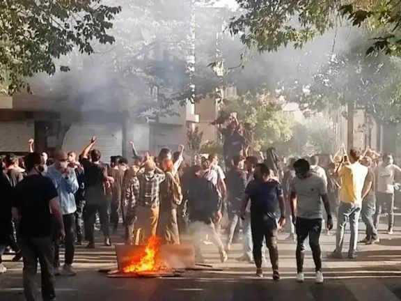 Protesters gather in the streets of Iran during the 2022 nationwide uprising