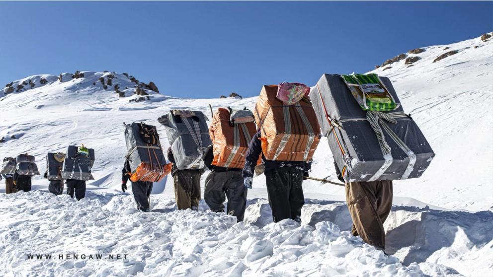 A group of Iranian cross-border porters, known as Kolbars