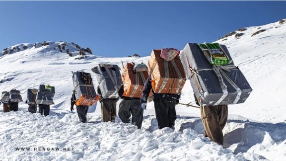 A group of Iranian cross-border porters, known as Kolbars