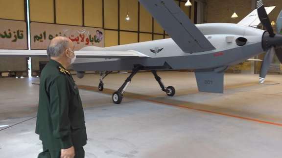 IRGC commander Hossein Salami looking at an Iranian-made drone