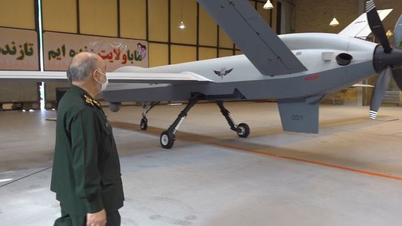 IRGC commander Hossein Salami looking at an Iranian-made drone