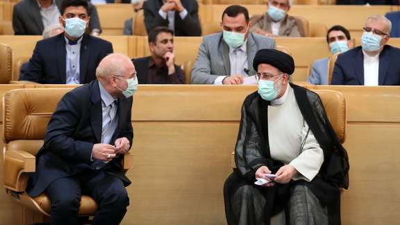 Iran’s Parliament Speaker Moahammad-Bagher Ghalibaf (left) and President Ebrahim Raisi