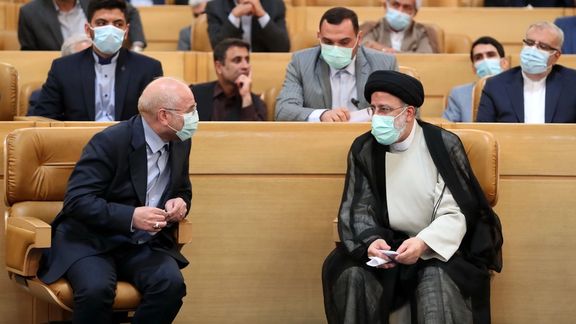 Iran’s Parliament Speaker Moahammad-Bagher Ghalibaf (left) and President Ebrahim Raisi