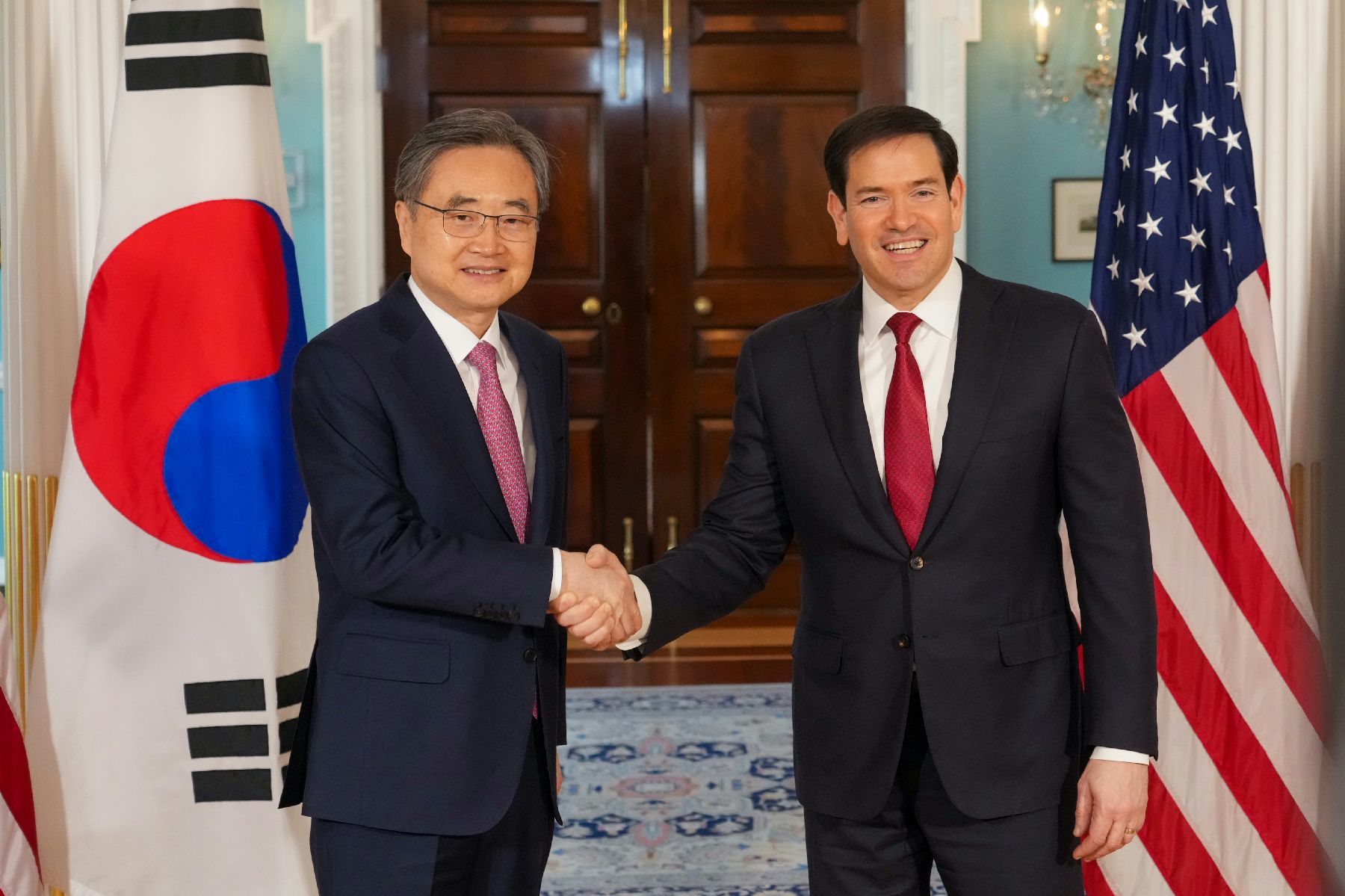 South Korean Foreign Minister Cho Hyun (left) shakes hands with US Secretary of State Marco Rubio at the State Department in Washington on Feb. 3, 2026. (South Korean Ministry of Foreign Affairs)
