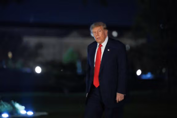 US President Donald Trump walks after disembarking from Marine One as he returns from a campaign rally in Syracuse, New York, on the South Lawn of the White House in Washington, DC, on October 9, 2026.