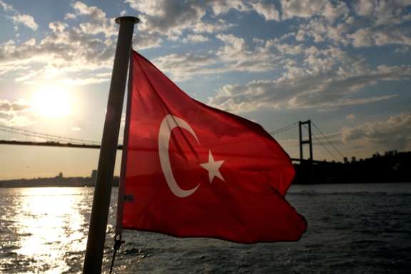 A Turkish flag with the Bosphorus Bridge in the background, flies on a passenger ferry in Istanbul, Turkey September 30, 2020.
