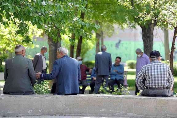 A group of Iranian elderly citizen in a park
