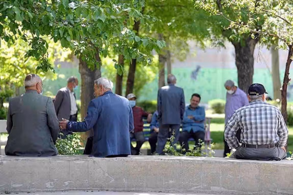 A group of Iranian elderly citizen in a park