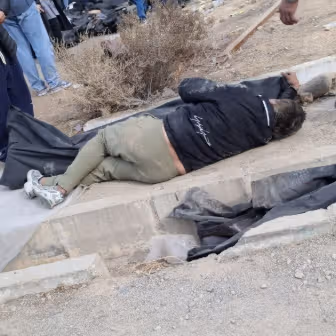 Iranian teen hid in body bag among slain protestors to survive - rights group