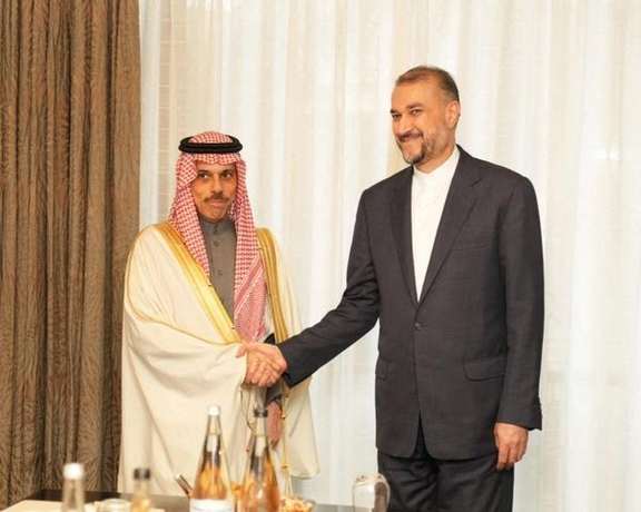 Saudi Arabia's Foreign Minister Prince Faisal bin Farhan (L) with his Iranian counterpart Hossein Amir-Abdollahian in Tehran on June 17, 2023
