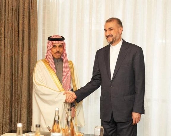 Saudi Arabia's Foreign Minister Prince Faisal bin Farhan (L) with his Iranian counterpart Hossein Amir-Abdollahian in Tehran on June 17, 2023