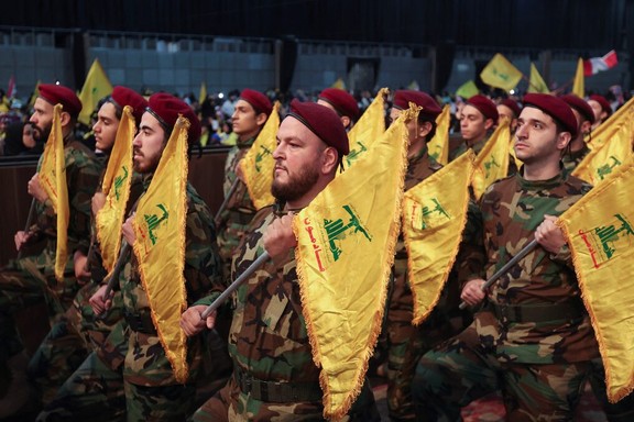 Members of Lebanon's Hezbollah hold flags during a rally commemorating the annual Hezbollah Martyrs' Day in Beirut's southern suburbs, Lebanon November 11, 2022.