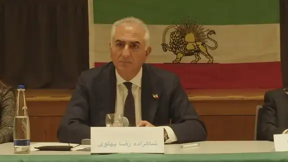 Iran's exiled Crown Prince Reza Pahlavi speaking at a meeting in Munich on February 16, 2025.