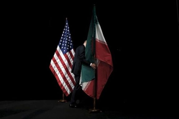 US and Iran flags at JCPOA nuclear talks in 2015