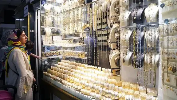 An Iranian woman shopping for gold