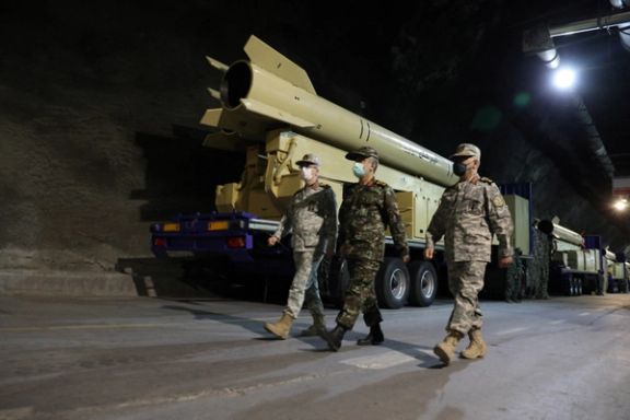 Iranian Armed Forces Chief of Staff Major General Mohammad Bagheri and IRGC Aerospace Force Commander Amir Ali Hajizadeh walk during the unveiling of "Kheibarshekan" missile at an undisclosed location in Iran, in this picture obtained on February 9, 2022.