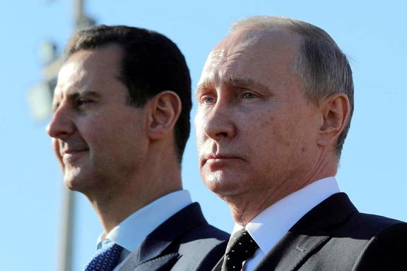 Russian President Vladimir Putin (R) and Syrian President Bashar al-Assad visit the Hmeymim air base in Latakia Province, Syria December 11, 2017.