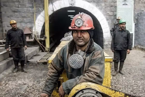 Iranian workers report layoffs, months of unpaid wages
