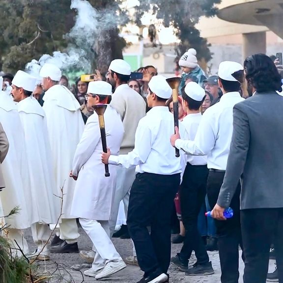 Zoroastrian fire priests carrying embers to light the Sadeh fire in Kerman