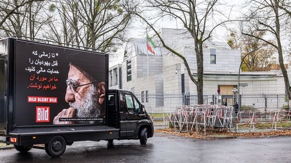 A placard by German paper condemning anti-Semitism outside Iran's embassy in Berlin (November 2023)