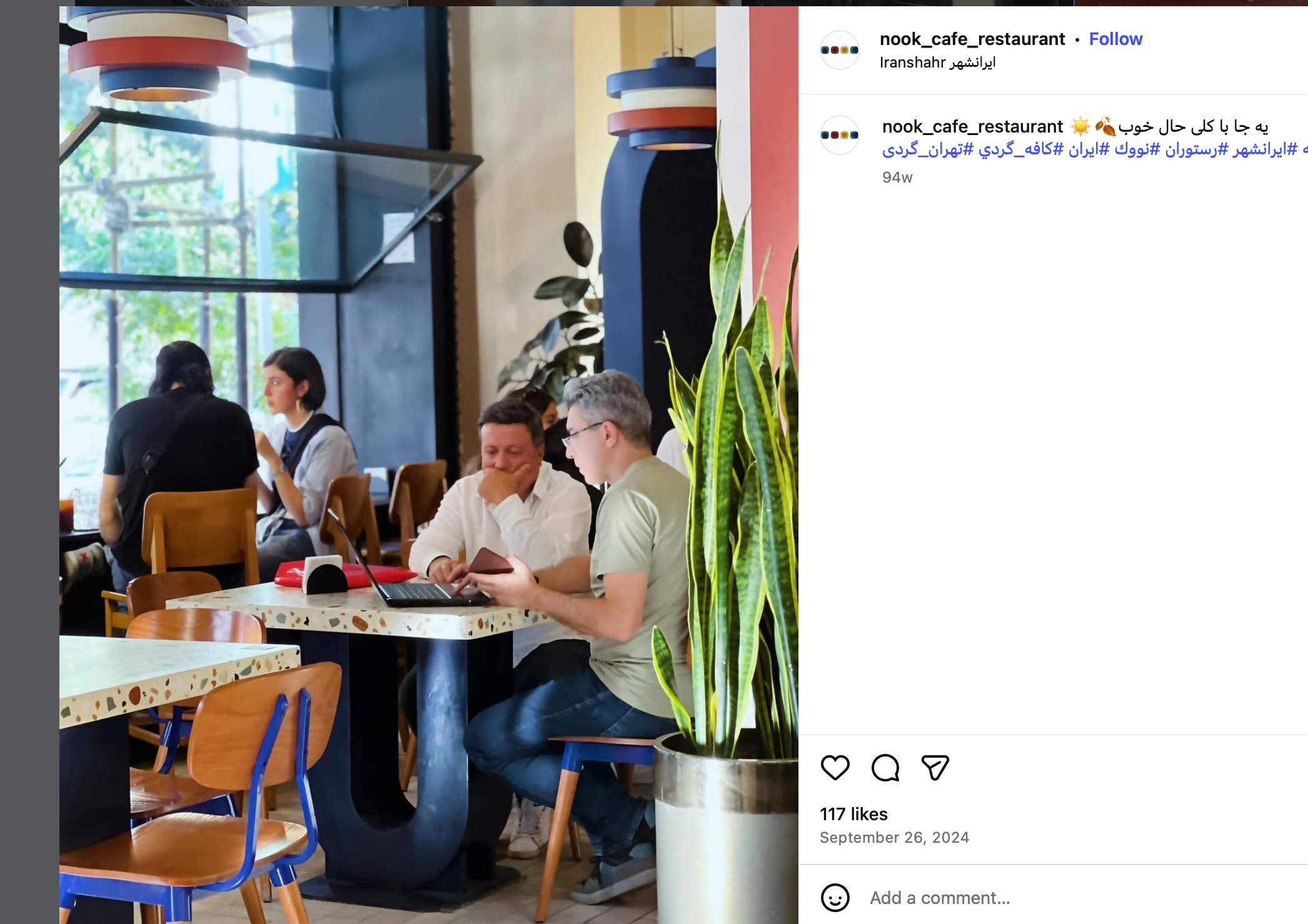 People talk and work at Nook Cafe in Tehran, Iran in this file photo from September 2024