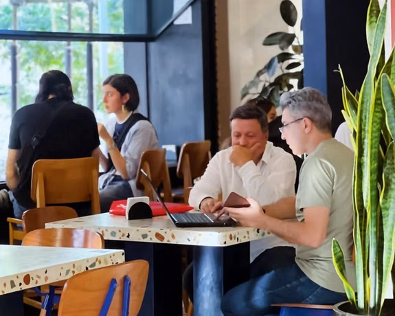 People talk and work at Nook Cafe in Tehran, Iran in this file photo from September 2024