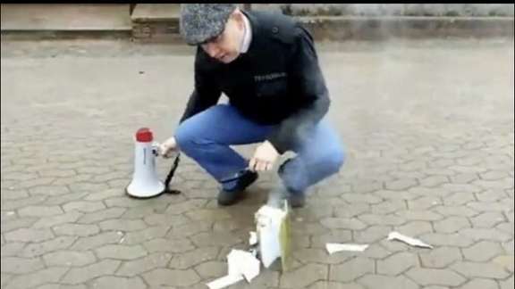 Leader of the Danish far-right political party Stram Kurs or Hard Line, Rasmus Paludan, is burning a copy of Quran in the southern Swedish city of Linköping on April 14, 2022.