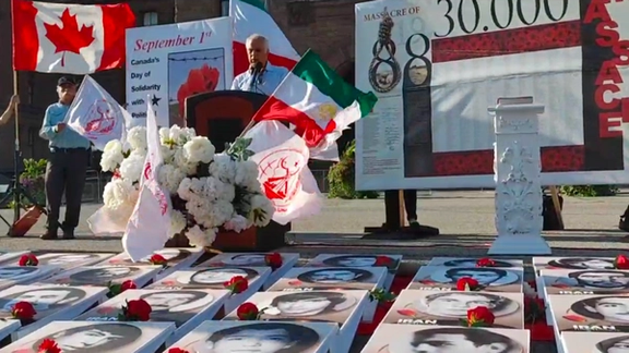 A group of Iranian-Canadians whose family members were killed in a wave of prison executions in 1988, at Queen's Park in Downtown Toronto, Ontario on August 31, 2022