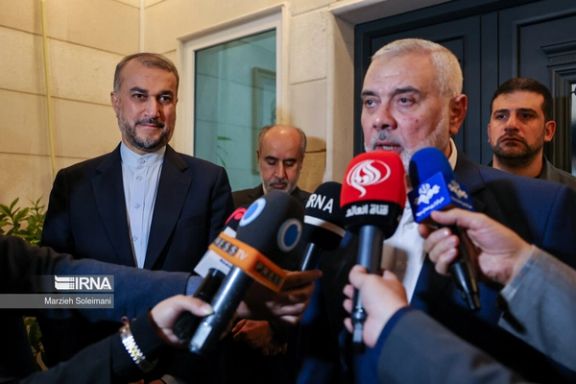 Iranian Foreign Minister Hossein Amir-Abdollahian (left) and Hamas's political leader Ismail Haniyeh in Doha on December 19, 2023