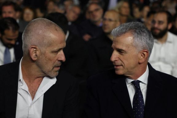 David Barnea, the head of the Israeli Mossad speaks with Ronen Bar, the head of Shin Bet during an event in Jerusalem (May 5, 2024)