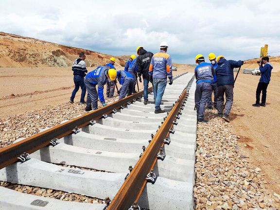Iranian workers constructing a railroad